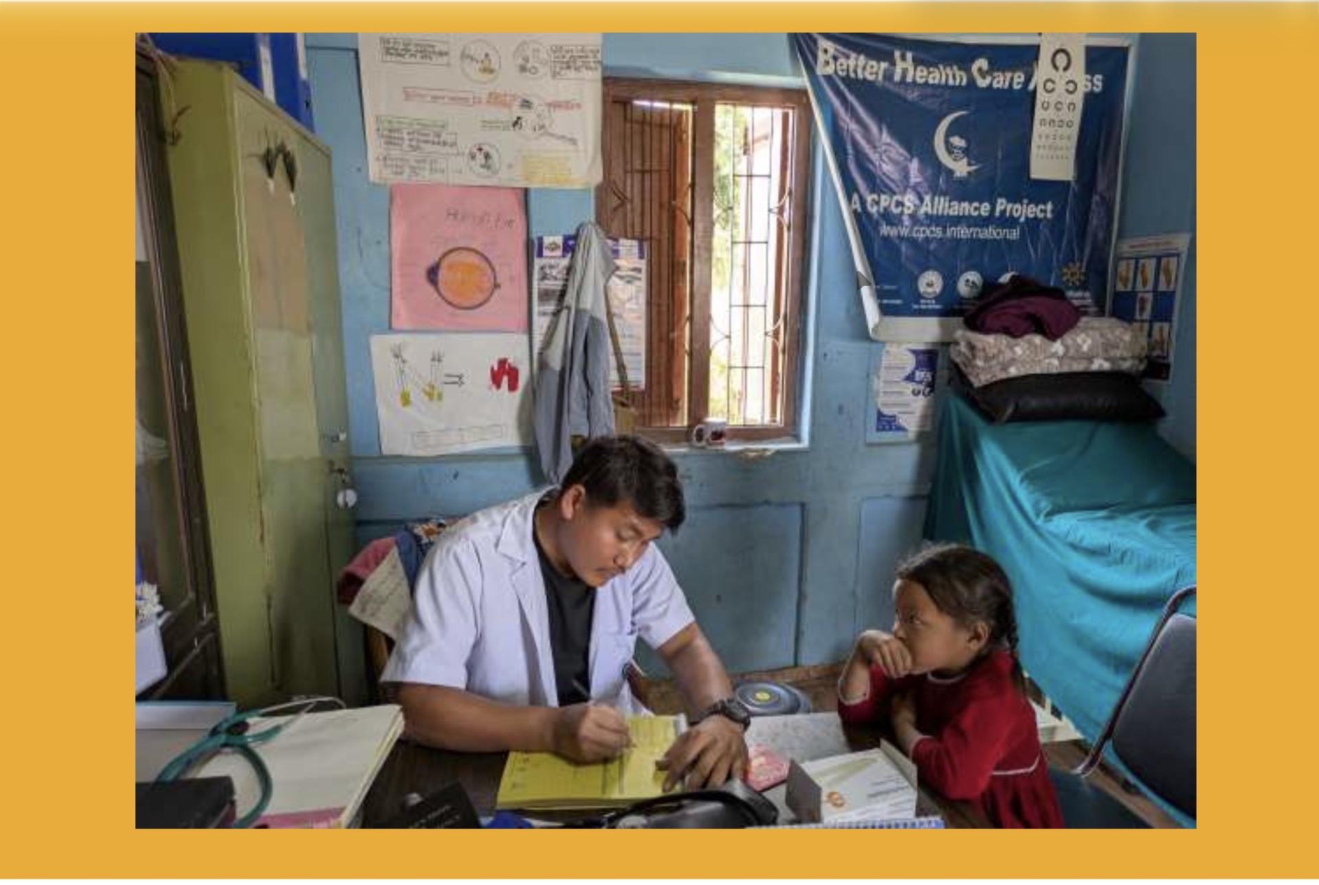 Health worker examining a child at a clinic